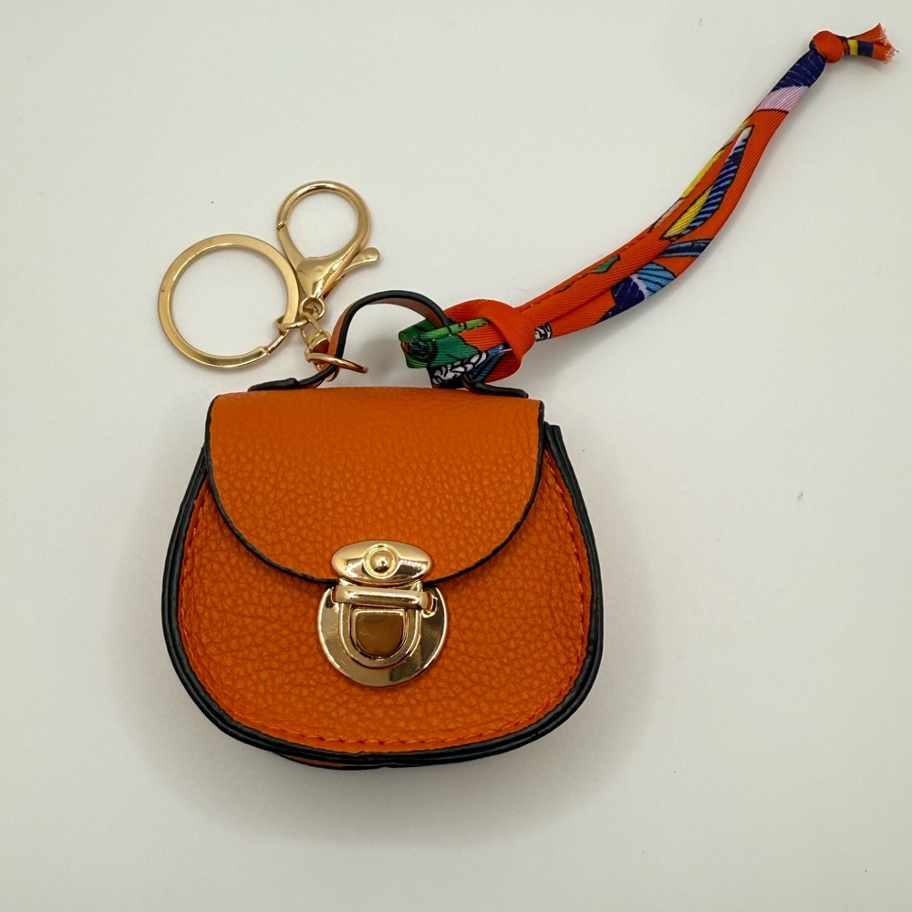 Elegant Orange Leather Bag Charm Keychain with Gold Hardware